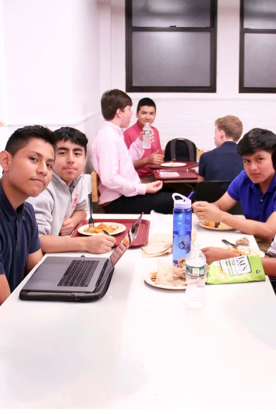 Students sitting at cafeteria table